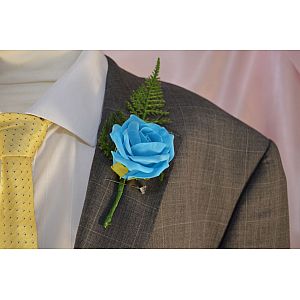 Mid Blue single artificial rose buttonhole with fern