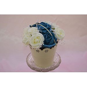 Ivory bucket with artificial roses and pearl loops